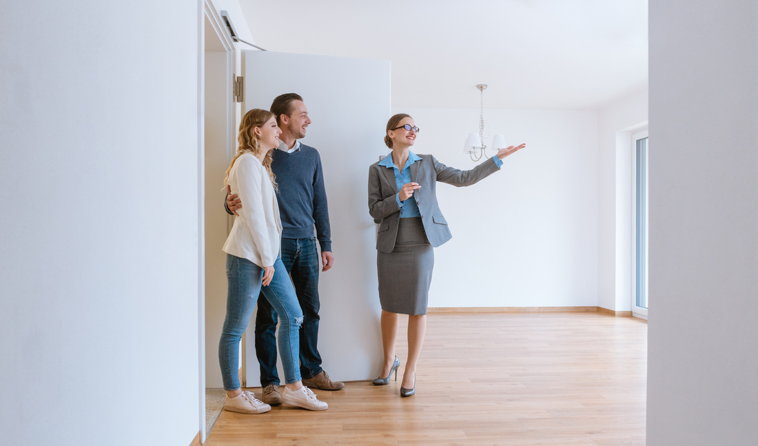 Realtor Showing House to a Young Couple